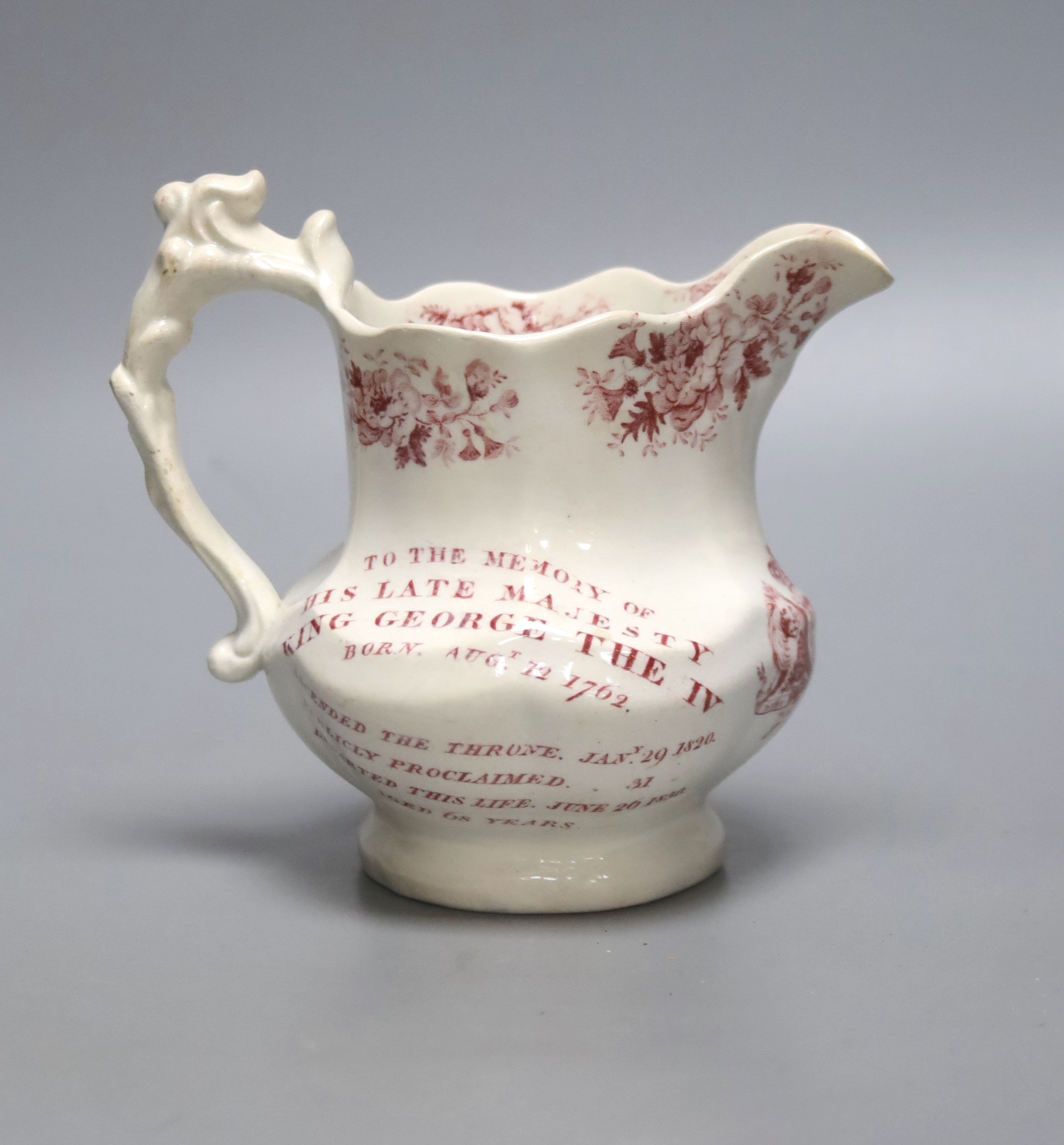 A George IV commemorative pottery jug, 14cm tall